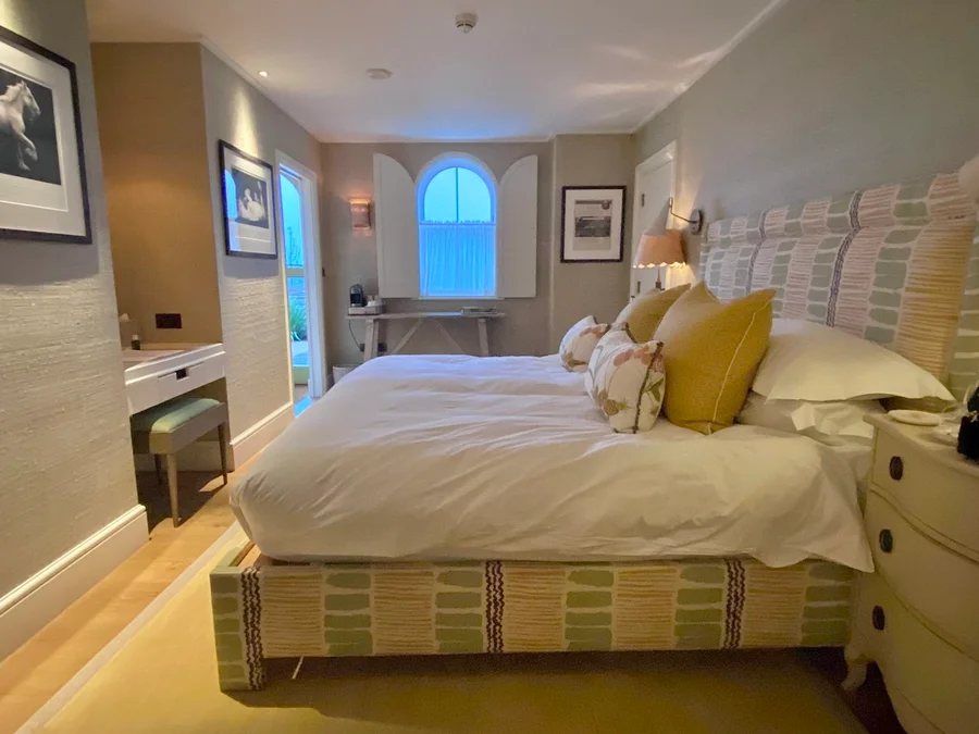 The bedroom in Beaverbrook’s Coach House Garden Suite